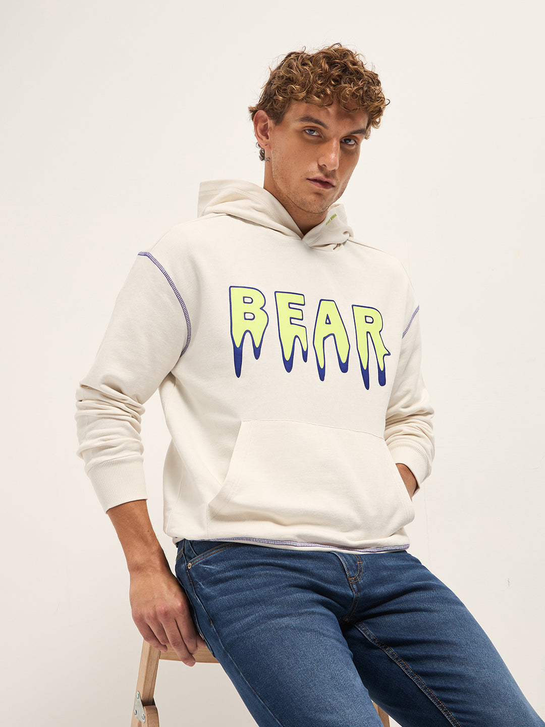 Shop White Relax Fit “BEAR” Drip Graphic Hoodie with Neon Stitch
