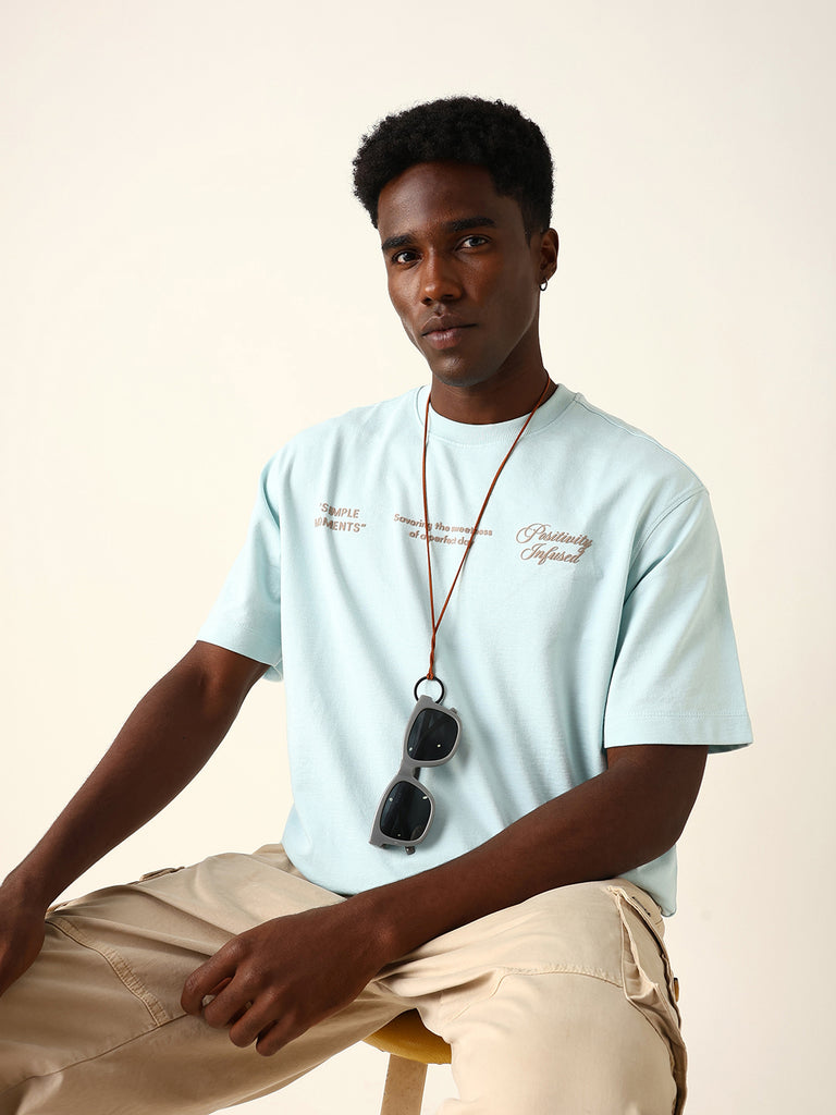 Shop Light Blue Oversized Crew Neck T-Shirt with “Simple Moments